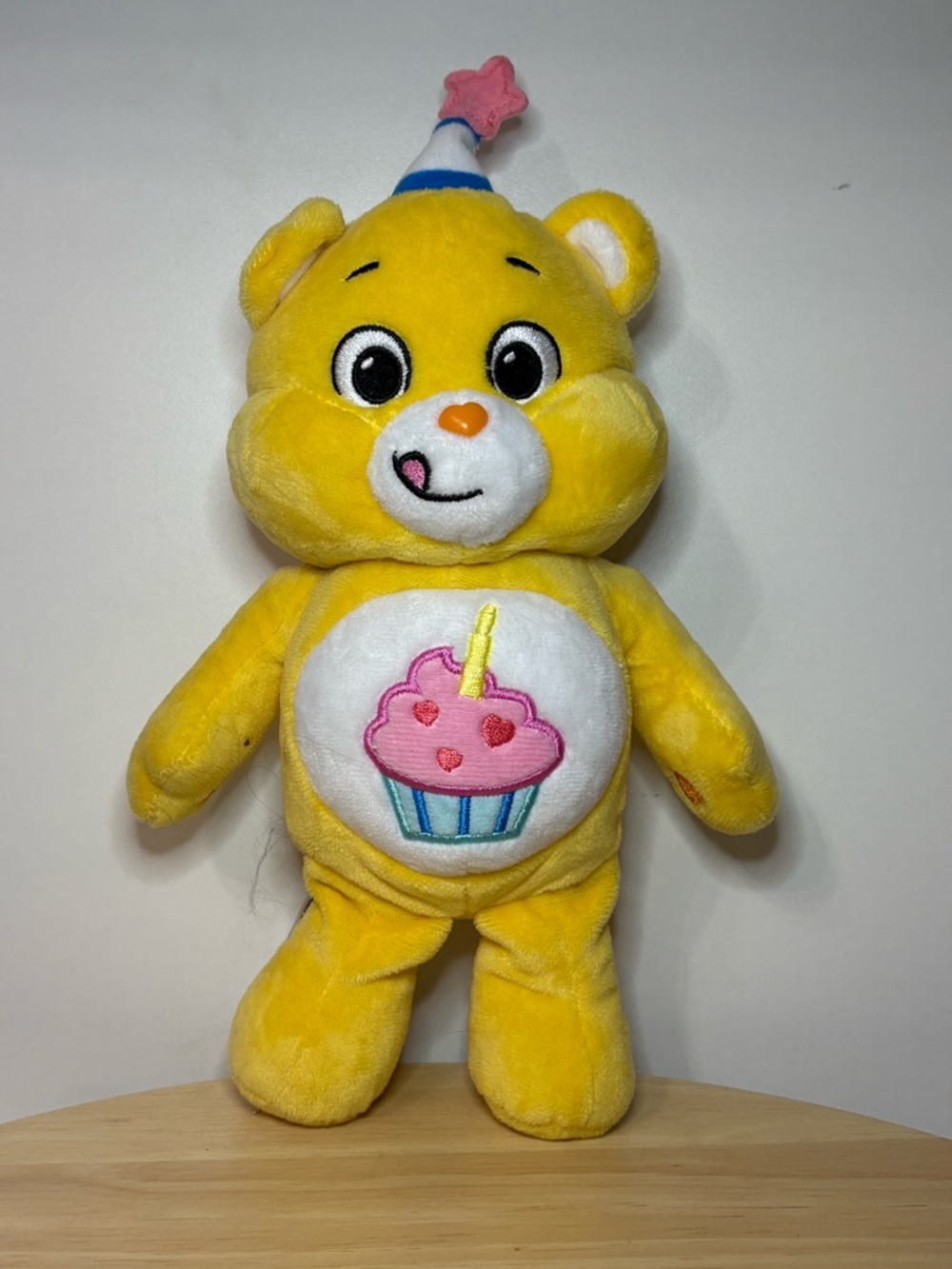 Care Bears Plushie Yellow Birthday Cupcake Plush Bear with Pink Badge